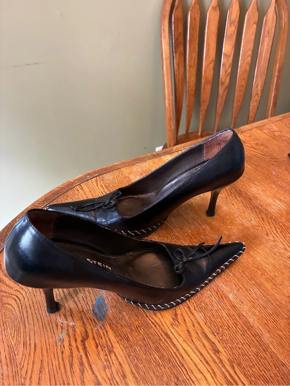 Black Pointed Leather Heels with Bow Accent